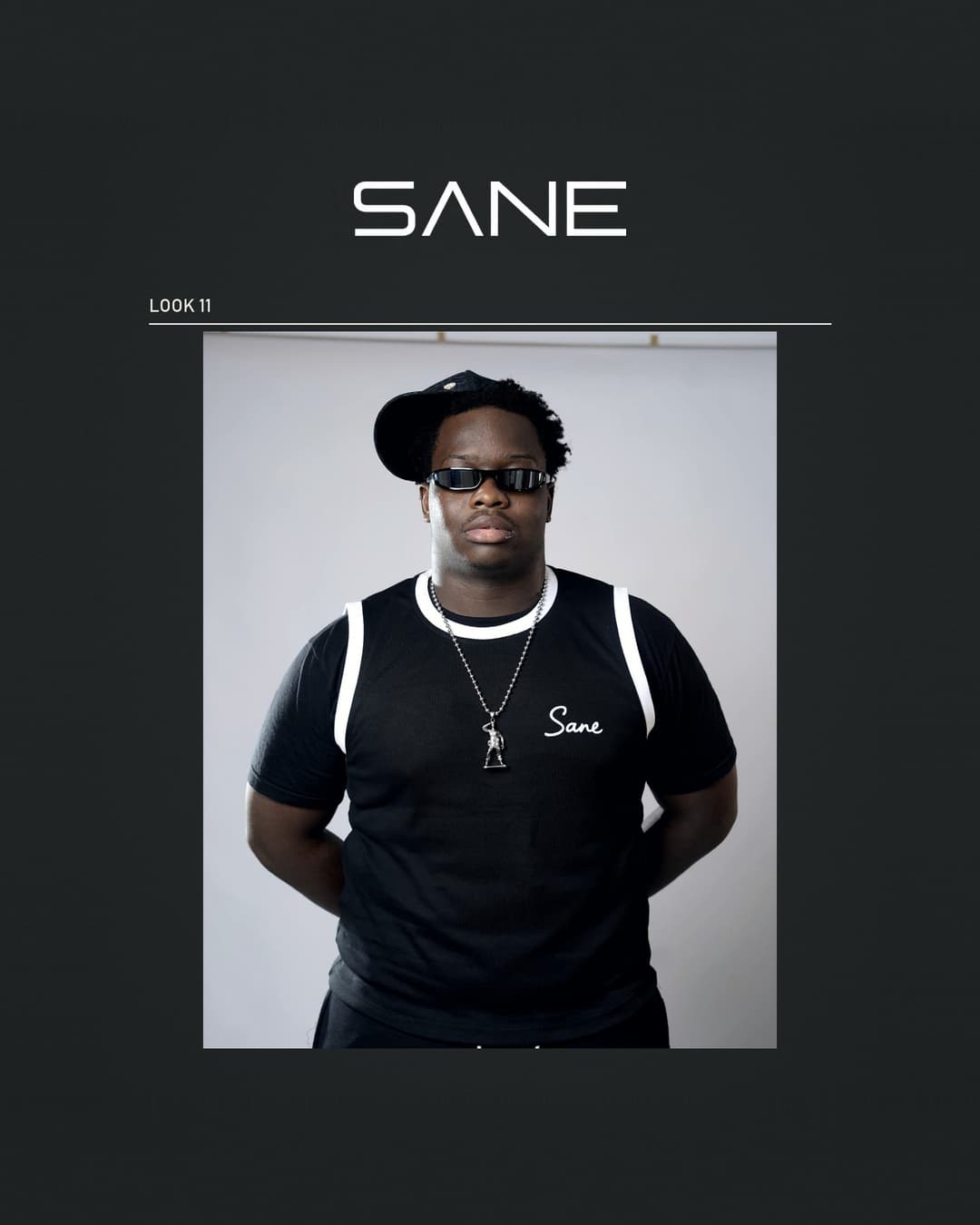 Model wearing the black Sane Tank Top with white trim